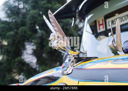 Buenos Aires, Argentina, June 20, 2022: hood ornament of a Mercedes Benz 1114, old vintage bus for public passenger transport, line 148 Stock Photo