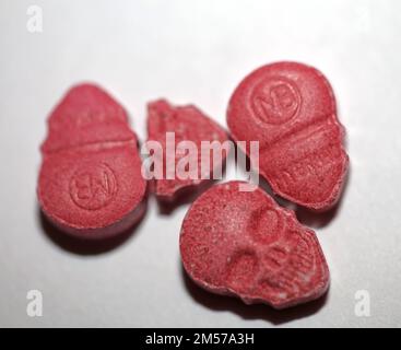 Purple skull world's strongest ecstasy pills close up background high quality big size dope print Stock Photo