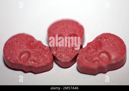 Purple skull world's strongest ecstasy pills close up background high quality big size dope print Stock Photo