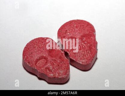 Purple skull world's strongest ecstasy pills close up background high quality big size dope print Stock Photo