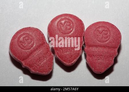 Purple skull world's strongest ecstasy pills close up background high quality big size dope print Stock Photo