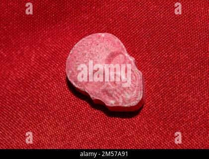 Purple skull world's strongest ecstasy pills close up background high quality big size dope print Stock Photo