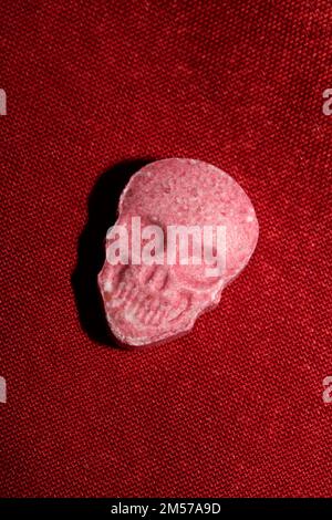 Purple skull world's strongest ecstasy pills close up background high quality big size dope print Stock Photo