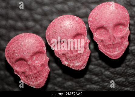 Purple skull world's strongest ecstasy pills close up background high quality big size dope print Stock Photo