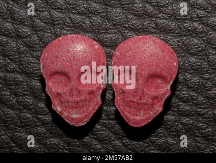 Purple skull world's strongest ecstasy pills close up background high quality big size dope print Stock Photo