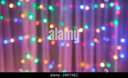 Widescreen abstract background of multicolored garland lights. Defocused image Stock Photo