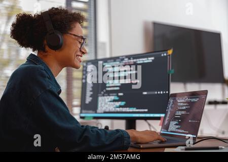 Freelancer female making new project as web designer and programmer on her computer at home office Stock Photo