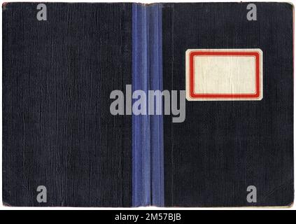 Vintage exercise book or notebook, open paper cover with canvas spine and empty label Stock Photo