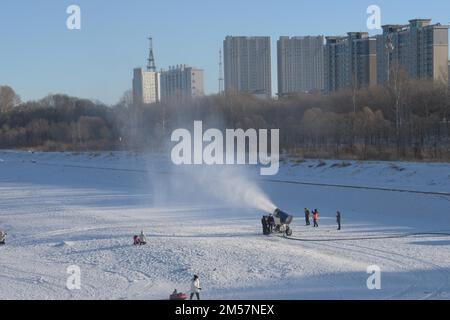 Workers use a snow gun to make artificial snow for the coming ice and snow  sculpture competition in Heihe City, northeast China's Heilongjiang  Province, 24 December, 2022. (Photo by ChinaImages/Sipa USA Stock
