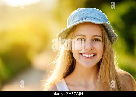 Happiest when Im outdoors. an attractive young woman spending the day outdoors. Stock Photo