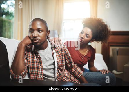 Please could we talk this through together. a young couple having relationship problems at home. Stock Photo