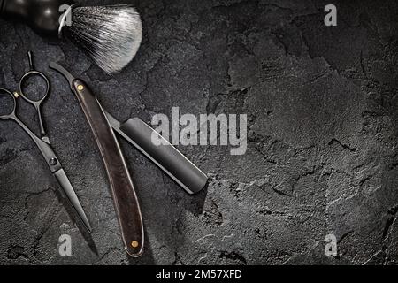 Black Tools Of Barber. Barber Shop. Professional Hair Cutting Scissors Hairdresser Stright Razor Shaving Brush. On Black Background Stock Photo