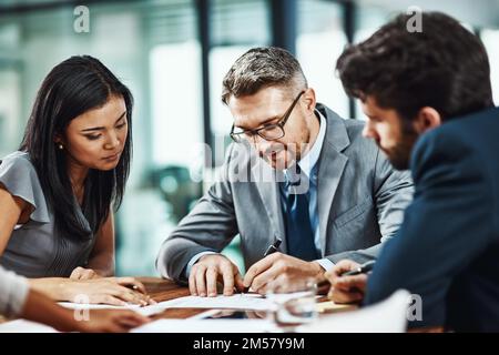 Putting productivity in focus. a group of colleagues having a meeting in a modern office. Stock Photo