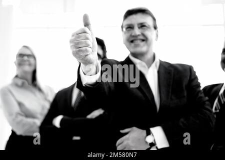 close up. smiling businessman giving a thumbs up. black and white photo. Stock Photo