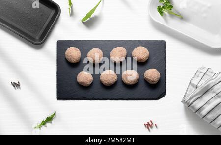 Meatballs on a flat lay of a kitchen with various items from above Stock Photo