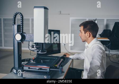 computer technology in the office. Technology HUD hologram and a woman taking notes. Development of programmers Team Development Website design and coding technologies Work in the office of a software development company.  Stock Photo