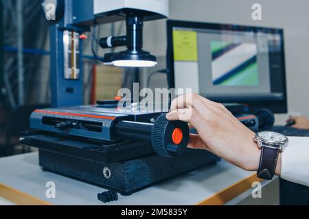 computer technology in the office. Technology HUD hologram and a woman taking notes. Development of programmers Team Development Website design and coding technologies Work in the office of a software development company.  Stock Photo