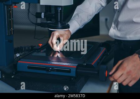 computer technology in the office. Technology HUD hologram and a woman taking notes. Development of programmers Team Development Website design and coding technologies Work in the office of a software development company.  Stock Photo