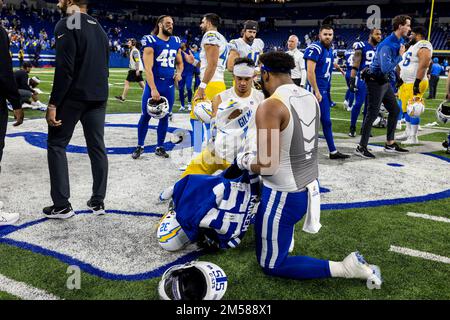 December 26, 2022: Los Angeles Chargers safety Alohi Gilman (32) and Indianapolis Colts defensive lineman Khalid Kareem (55) exchange jerseys after NFL game in Indianapolis, Indiana. John Mersits/CSM. Stock Photo