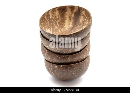 Empty coconut bowl on a white background. Bowls made from coconut shell. Stock Photo