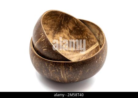 Empty coconut bowl on a white background. Bowls made from coconut shell. Stock Photo