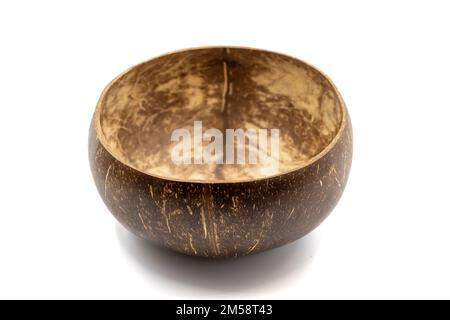 Empty coconut bowl on a white background. Bowls made from coconut shell. Stock Photo