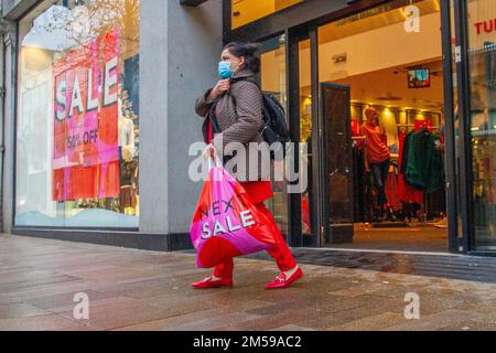 Next Sale in Preston, Lancashire.  Dec 2022. UK Weather.  Damp start to the day for Next high street sales in Fishergate Preston. Credit; MediaWorldImages/AlamyLiveNews Stock Photo