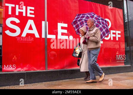 Boxing day sales in Preston, Lancashire. Dec 2022. UK Weather.  Damp start to the day for Marks and Spencer city centre high street sale in Fishergate Preston. Stock Photo