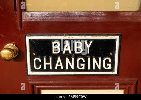 England, Sussex, Bluebell Railway, Sheffield Park Station, Vintage Baby Changing Room Sign *** Local Caption ***  UK,United Kingdom,Great Britain,Brit Stock Photo