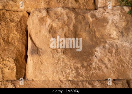 Remains of an ancient handcrafted wall. grunge texture. abstract background. Stock Photo