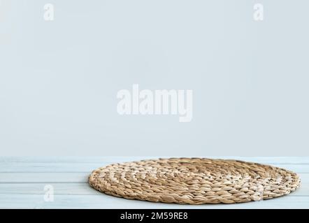 Wooden white table top with napkin and free space for installing the product or layout on the light background. Copy  space. Stock Photo