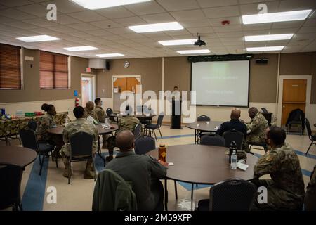 Members of Team Dyess and the Abilene community listen to a speech during a Black History Month luncheon at Dyess Air Force Base, Texas, Feb. 22, 2022. During the luncheon, Airmen and the Abilene Police Chief, Marcus Dudley, spoke about the importance of celebrating black history. Stock Photo