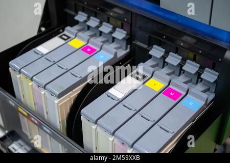 Row of inkjet printer CMYK cartridges - close up Stock Photo