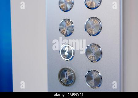 Elevator floor buttons on lift control panel at mall, hotel or business center Stock Photo