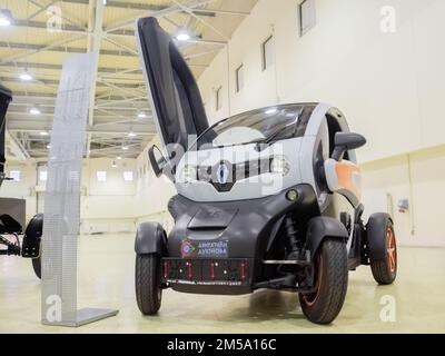 Small white electric two seater Renault Twizy at electric urban car exhibition Stock Photo