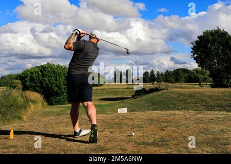 Golfer on the Old Nene Golf & Country Club, near Ramsey town, Cambridgeshire, England Stock Photo