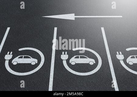 Electric vehicle charger signs marked on outdoor parking lots. Illustration of the concept of high demand of EV charging points Stock Photo