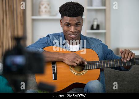 young guitar player recording video for his blog Stock Photo