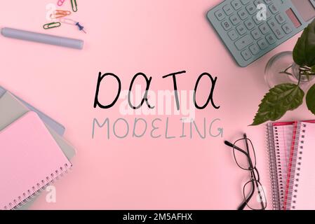 Hand writing sign Data Modeling. Business approach process of transferring data between data storage systems Stock Photo