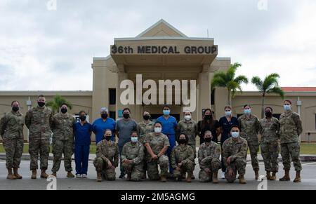 Service members assigned to the COVID-19 Testing Center, 36th Medical Group, pose for a photo at Andersen Air Force Base, Guam, Feb. 17, 2022. The CTC provided medical support to Cope North 2022 through testing, tracking movement and implementing COVID-19 guidance to more than 3000 CN22 personnel. Stock Photo