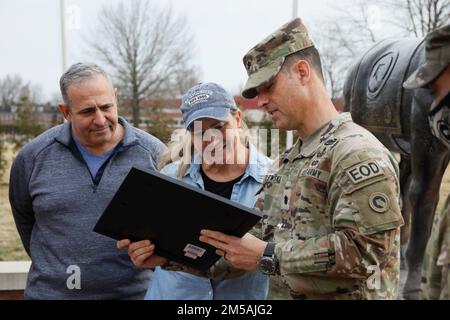 Lt. Col. Brian Kibitlewski, battalion commander, Special Troops Battalion, 1st Theater Sustainment Command, presents an award to Mrs. Kristen Smalls, Soldier and Family Readiness Group volunteer, during an awards ceremony at Fort Knox, Kentucky, Feb. 17, 2022. Small previously was recognized as the U.S. Army Central Volunteer of the Year. Stock Photo