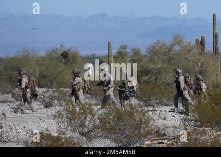 U.S. Marines with 1st Battalion, 4th Marine Regiment, 1st Marine Division, move to a combat town during an air assault as part of Winter Fury 22 outside of Marine Corps Air Station Yuma, Arizona, Feb. 16, 2022. Winter Fury 22 stresses the increased flow of information and information exchange requirements through existing capabilities and previously untested processes. Winter Fury 22 provides the Marines of 3rd Marine Aircraft Wing with realistic, relevant training opportunities necessary to respond to any crisis across the globe and win decisively in a highly contested, maritime conflict. Stock Photo