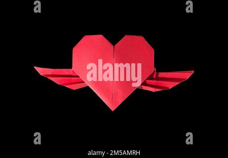 red paper heart with wings, creative art design, holiday concept Stock Photo