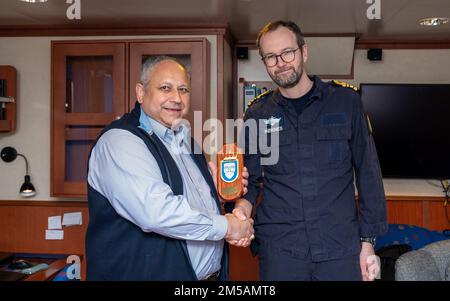 BERGEN, Norway (Feb. 16, 2022) — Secretary of the Navy Carlos Del Toro receives an award from Norwegian Cmdr. Lars Ole Høknes, commanding officer of HNoMS Thor Heyerdahl (F314), aboard the ship in Bergen, Norway, Feb. 16, 2022. Secretary Del Toro is in Norway to visit U.S. service members and Norwegian government leaders to reinforce existing bilateral and multilateral security relationships between the U.S. Navy and the Royal Norwegian Navy. Stock Photo