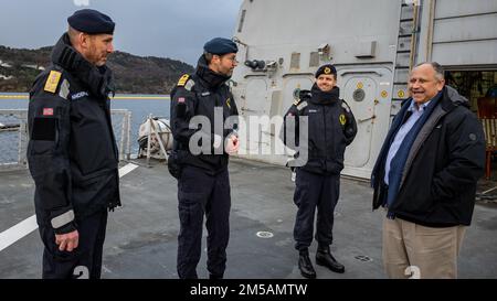 BERGEN, Norway (Feb. 16, 2022) — Secretary of the Navy Carlos Del Toro greets Norwegian Cmdr. Lars Ole Høknes, commanding officer of HNoMS Thor Heyerdahl (F314), center, and Rear Adm. Rune Andersen, Chief of the Royal Norwegian Navy, left, in Bergen, Norway, Feb. 16, 2022. Secretary Del Toro is in Norway to visit U.S. service members and Norwegian government leaders to reinforce existing bilateral and multilateral security relationships between the U.S. Navy and the Royal Norwegian Navy. Stock Photo