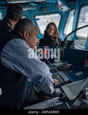 BERGEN, Norway (Feb. 16, 2022) — Secretary of the Navy Carlos Del Toro addresses the crew of HNoMS Thor Heyerdahl (F314) over the ship’s loudspeaker with Norwegian Cmdr. Lars Ole Høknes, commanding officer of Heyerdahl, in Bergen, Norway, Feb. 16, 2022. Secretary Del Toro is in Norway to visit U.S. service members and Norwegian government leaders to reinforce existing bilateral and multilateral security relationships between the U.S. Navy and the Royal Norwegian Navy. Stock Photo