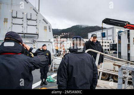 BERGEN, Norway (Feb. 16, 2022) — Secretary of the Navy Carlos Del Toro renders honors to the Norwegian flag and crew of HNoMS Thor Heyerdahl (F314), in Bergen, Norway, Feb. 16, 2022. Secretary Del Toro is in Norway to visit U.S. service members and Norwegian government leaders to reinforce existing bilateral and multilateral security relationships between the U.S. Navy and the Royal Norwegian Navy. Stock Photo