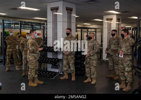 U.S. Air Force Tech. Sgt. Ryan Smith (left), Special Warfare Training Wing, physical medicine technician, briefs U.S. Space Force Brig. Gen. Shawn N. Bratton (center right), Commander, Space Training and Readiness Command and Chief Master Sgt. James P. Seballes (left), Space Training and Readiness Command, senior enlisted leader, during their visit to the SWTW, Feb. 16, 2022, Joint Base San Antonio-Chapman Annex, Texas. The STARCOM senior leaders learned how the SWTW combines research, technology integration, strength and conditioning, performance nutrition, physical and occupational therapy, Stock Photo