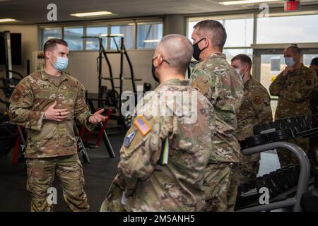 U.S. Air Force Tech. Sgt. Ryan Smith (left), Special Warfare Training Wing, physical medicine technician, briefs U.S. Space Force Brig. Gen. Shawn N. Bratton (center right), Commander, Space Training and Readiness Command and Chief Master Sgt. James P. Seballes (left), Space Training and Readiness Command, senior enlisted leader, during their visit to the SWTW, Feb. 16, 2022, Joint Base San Antonio-Chapman Annex, Texas. The STARCOM senior leaders learned how the SWTW combines research, technology integration, strength and conditioning, performance nutrition, physical and occupational therapy, Stock Photo