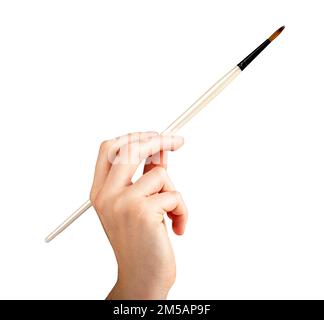 Paintbrush, paint brush in hand of artist, making brushstroke isolated on white background. High quality photo Stock Photo